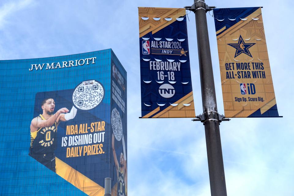 Signs of the upcoming NBA All-Star Game are seen in downtown Indianapolis Thursday, Feb. 1, 2024. A giant sign on the JW Marriott is seen looking down on Washington St.