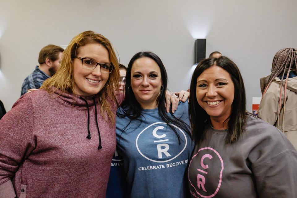 Tana Zimmerman, Ashley Morales and Danyell Fields (left to right) were among those who attended Friday's presentation by Korn guitarist and vocalist Brian "Head" Welch at Legacy Church in New Philadelphia. All three women belong to the Celebrate Recovery group at LifeWay Church.