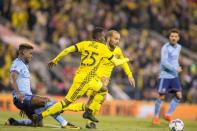 Oct 31, 2017; Columbus, OH, USA; Columbus Crew SC defender Harrison Afful (25) and forward Federico Higuain (10) defend to clear the ball away from New York City FC forward Sean Okoli (9) in the second half at MAPFRE Stadium. Mandatory Credit: Trevor Ruszkowski-USA TODAY Sports