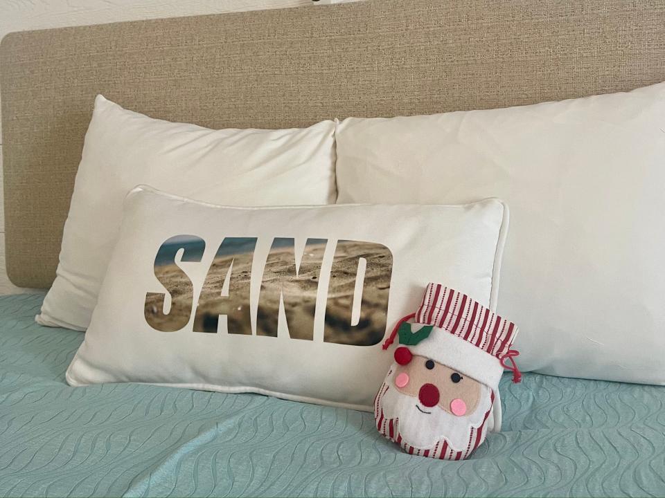 santa pillow on a universal orlando resort bed