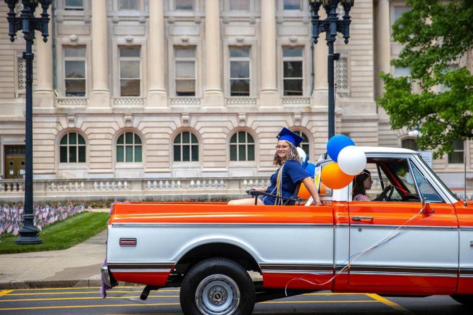 Graduating Frankfort High School seniors, including Macy Dungan, paraded from the school to the nearby Kentucky state Capitol the day before graduation, May 20, 2021, in Frankfort, Ky.