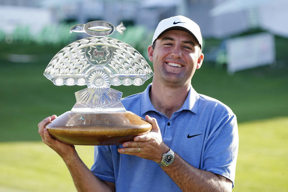 FILE - Scottie Scheffler holds up the championship trophy after the final round of the Phoenix Open golf tournament, Sunday, Feb. 12, 2023, in Scottsdale, Ariz. Scheffler is expected to compete in the PGA Championship next week at Oak Hill Country Club in Pittsford, N.Y.(AP Photo/Darryl Webb, File)