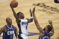 Orlando Magic guard Dwayne Bacon (8) shoots over Charlotte Hornets guard Brad Wanamaker during the second half of an NBA basketball game in Charlotte, N.C., Friday, May 7, 2021. (AP Photo/Nell Redmond)