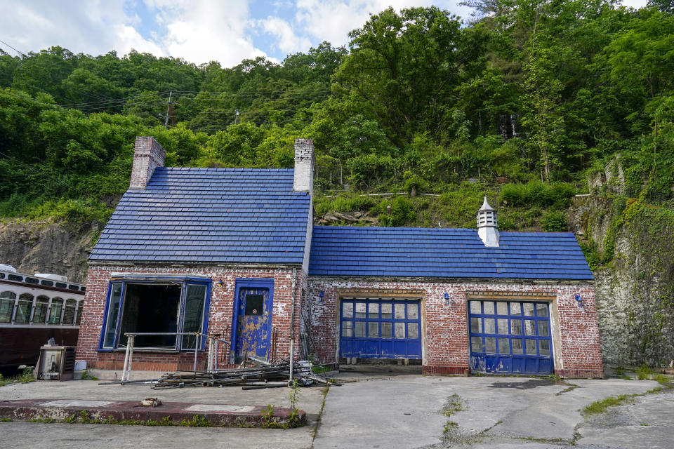 The remains of a service station is seen on Thursday, June 1, 2023, in Welch, W.Va. In March, the weekly publication in McDowell County one of the poorest counties America became another one of the quarter of all U.S. newspapers that have shuttered since 2005, a crisis Nester called "terrifying for democracy" and one that disproportionately impacts rural America. (AP Photo/Chris Carlson)