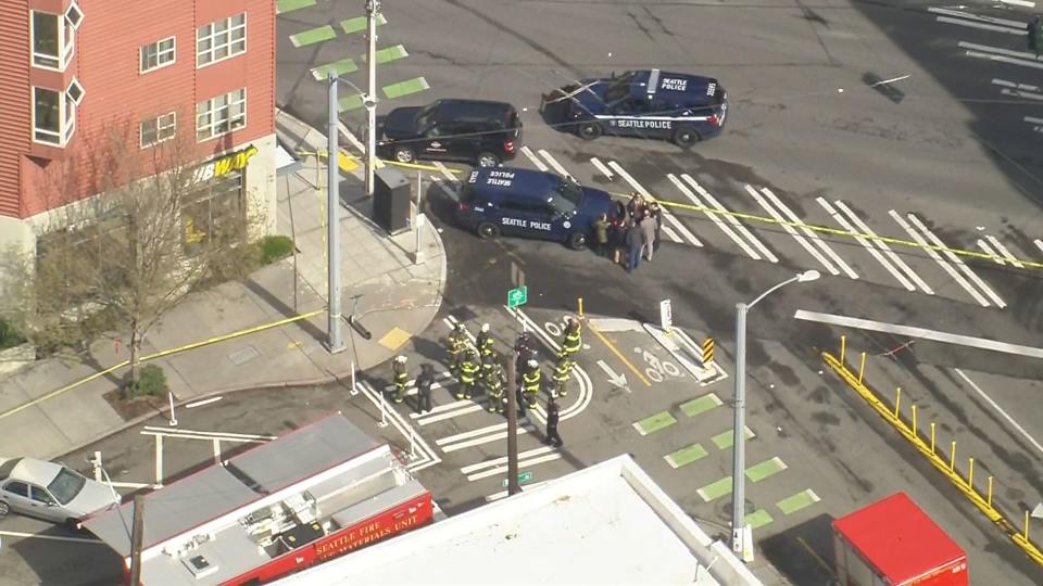 Firefighters, police, a bomb squad and a hazmat team were called to an apartment building in Seattle's Lower Queen Anne neighborhood for reports of an explosion and fire.
