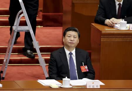 China's President Xi Jinping attends the opening session of the National People's Congress (NPC) in Beijing, China, March 5, 2016. REUTERS/Jason Lee