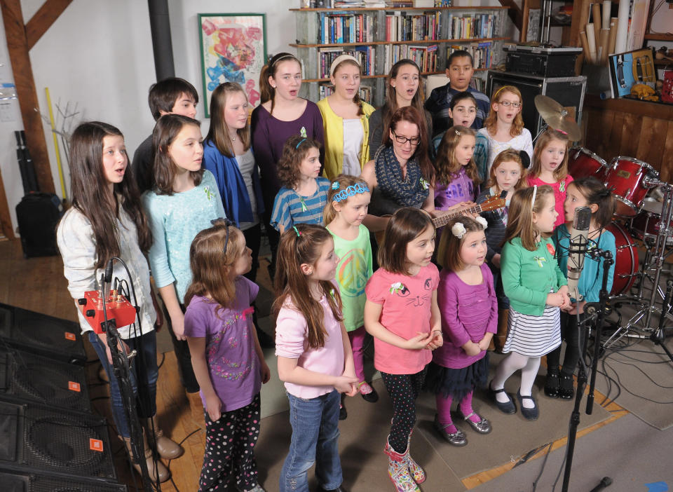 Children of Newton, CT perform "A Song From Sandy Hook" with Ingrid Michaelson (C) at the home of Chris Frantz and Tina Weymouth of the Talking Heads on January 14, 2013 in Fairfield, Connecticut. (Photo by Michael Loccisano/Getty Images for Tim Hayes)