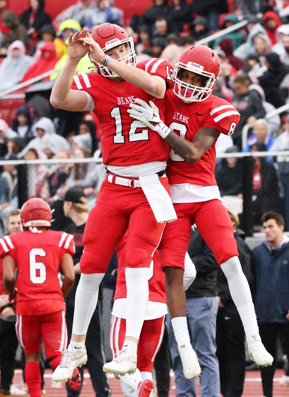 Bridgewater State University's Daniel Akinsheye, right, makes the catch and scores a touchdown and is congratulated by quarterback James Cahoon during their homecoming game versus Fitchburg State University on Saturday, Oct. 01, 2022. 