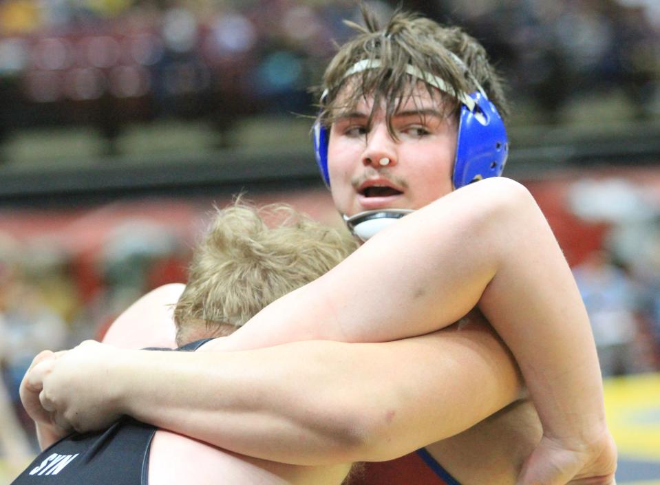 Lakewood's Keegan Jacks wrestles New Philadelphia's Garrett Dillon-Rine in a heavyweight match during the Division II state championships at Ohio State's Schottenstein Center on Saturday, March 9, 2024.