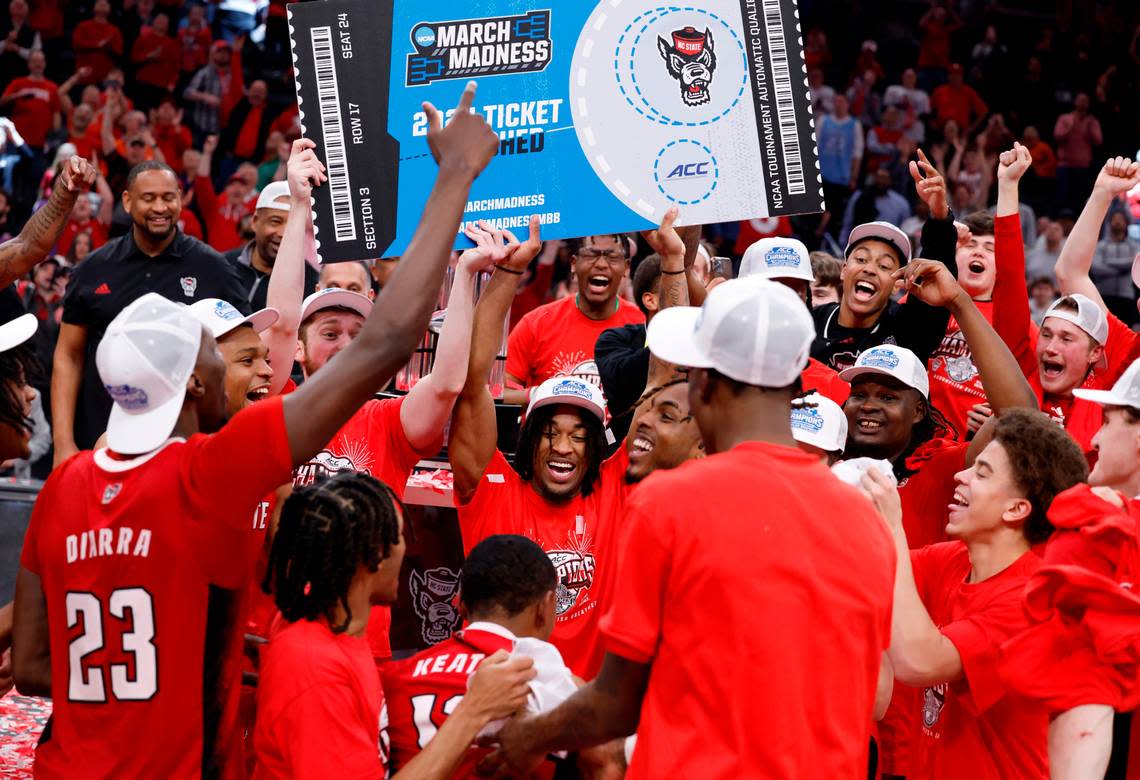 N.C. State celebrates after punching their ticket to the NCAA Tournament after the Wolfpack’s 84-76 victory over UNC in the championship game of the 2024 ACC Men’s Basketball Tournament at Capital One Arena in Washington, D.C., Saturday, March 16, 2024.