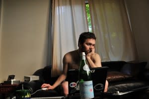 Slob working from home with beer and in underwear