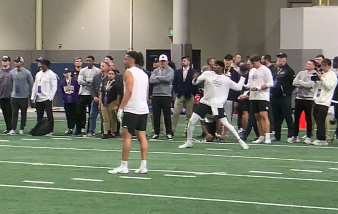 Michael Penix Jr. throws at the University of Washington Pro Day in front of Seahawks general manager John Schneider and personnel from at least 30 of the NFL’s 32 teams on March 28, 2024, at UW’s Dempsey Indoor practice facility. Penix is expected to be a high pick in the 2024 NFL draft. Gregg Bell/The News Tribune