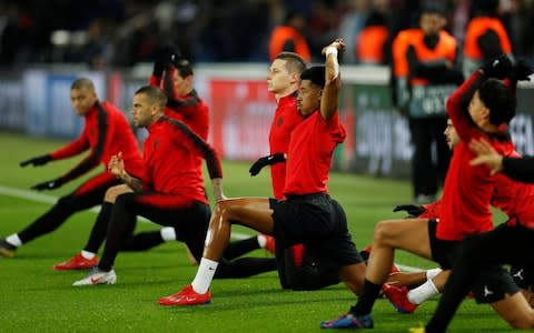 Paris St Germain's Julian Draxler, Presnel Kimpembe and team mates during the warm up before the match - Credit: REUTERS