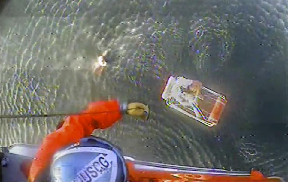 Photo of the Coast Guard rescuing David Lesh and his friend Kayla after their plane went down in Half Moon Bay.