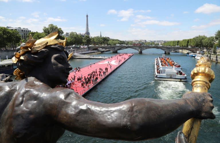 A floating running track on the River Seine is part of an event to promote a bid by Paris for the Summer Olympics in 2024