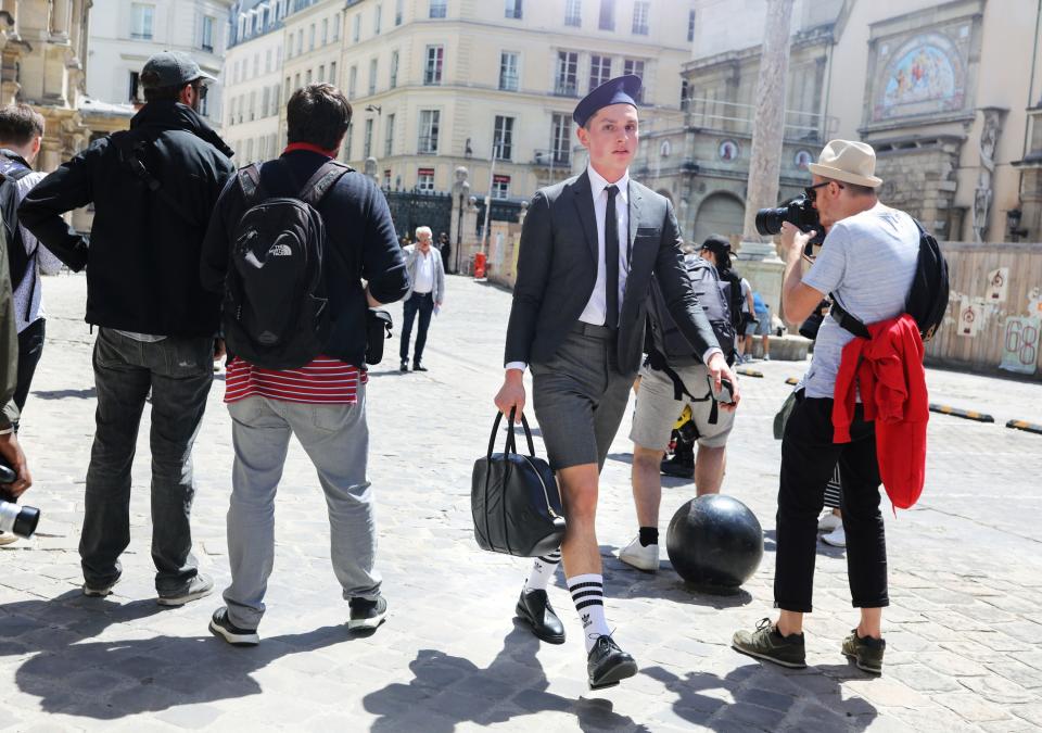 <h1 class="title">In a Thom Browne suit</h1><cite class="credit">Photographed by Phil Oh</cite>