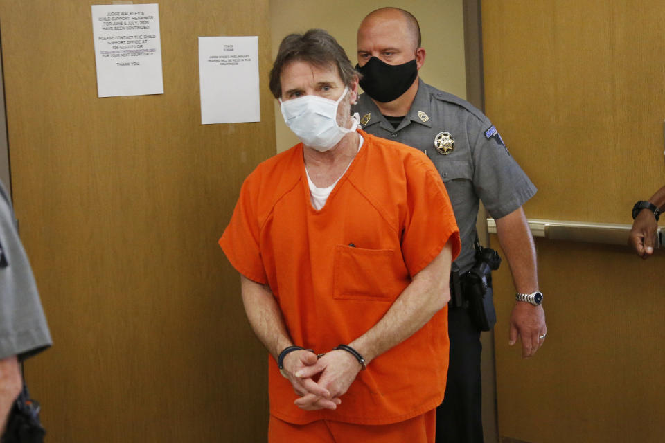 Max Townsend, the man accused of killing three Moore High School cross-county runners and injuring several others in alleged hit and run crash, leaves the courtroom during a lunch break in a preliminary hearing in Norman, Okla., Friday, July 24, 2020. (AP Photo/Sue Ogrocki)