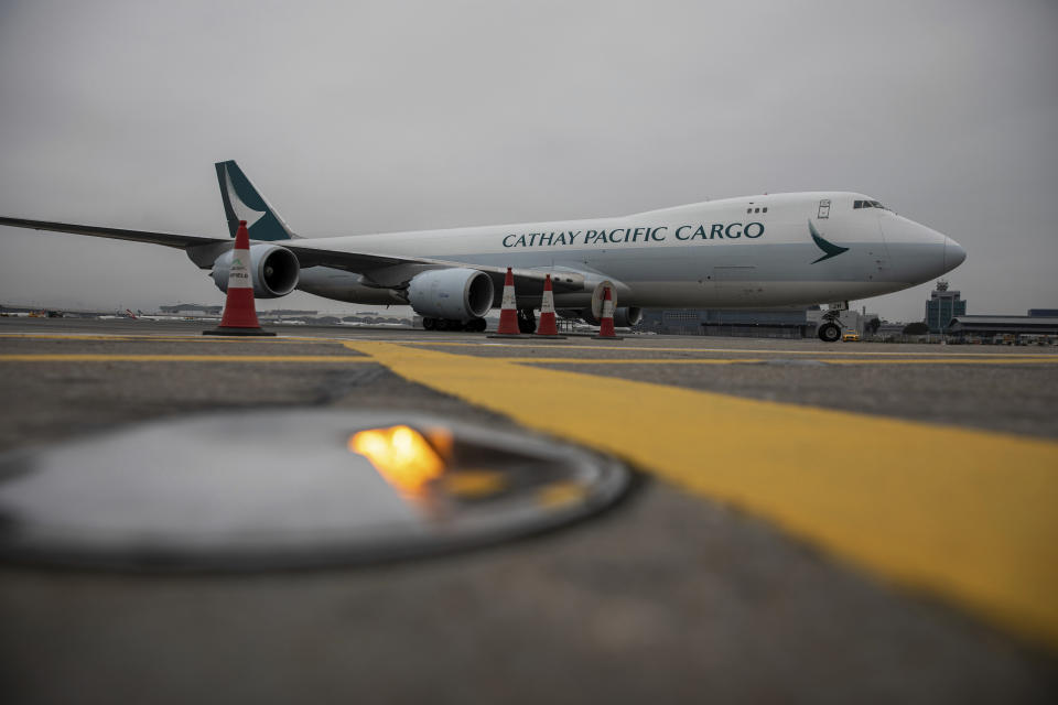 A Cathay Pacific cargo plane carrying Pfizer-BioNTech coronavirus vaccines prepares to dock at the Hong Kong International Airport in Hong Kong, Saturday, Feb. 27, 2021. (Jerome Favre/Pool Photo via AP)