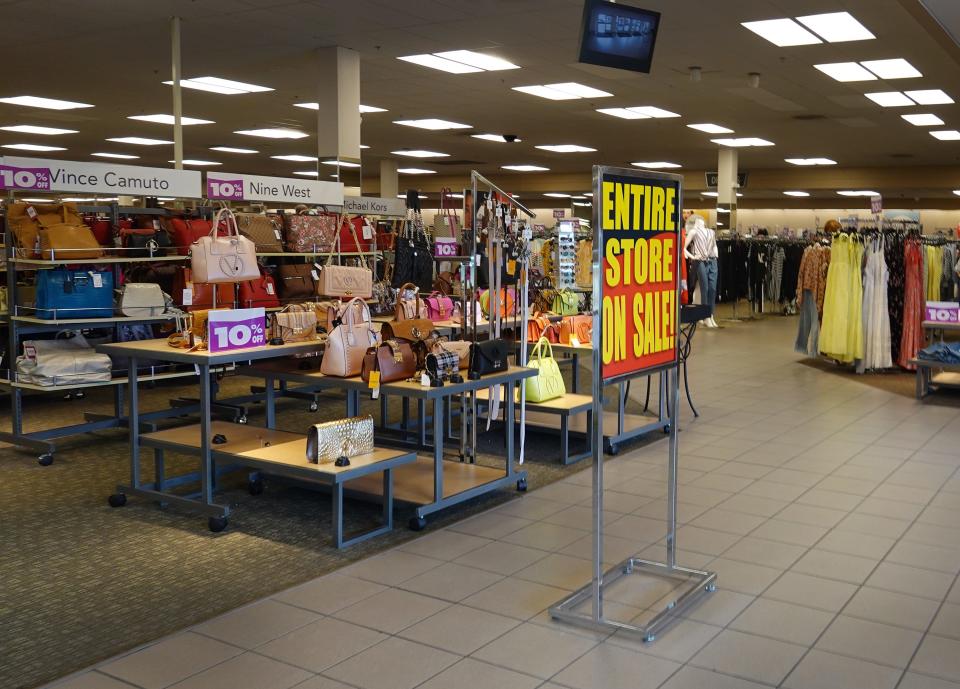 A sign reading, '"Entire Store on Sale," at the entrance to a Stein Mart store on Aug. 12 in Miami.