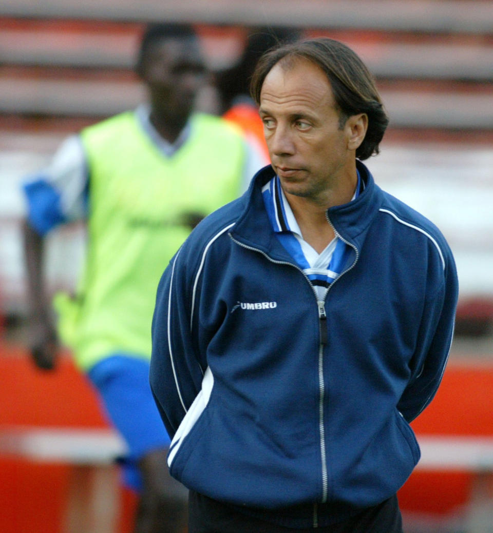 FILE - In this March 12, 2004, file photo, Haiti men's national team soccer coach Fernando Clavijo watches his team warm up at the Orange Bowl in Miami. Clavijo, a surprise starter for the 1994 U.S. World Cup team who went on to a coaching and management career in Major League Soccer, died Friday, Feb. 8, 2019, at his home in Fort Lauderdale, Fla., from multiple myeloma. He was 63. (AP Photo/Luis M. Alvarez, File)