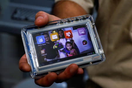 Inmate Ignacio Rodriguez shows his JPay tablet device inside the East Jersey State Prison in Rahway, New Jersey, U.S., July 12, 2018. REUTERS/Brendan McDermid NO RESALES. NO ARCHIVES