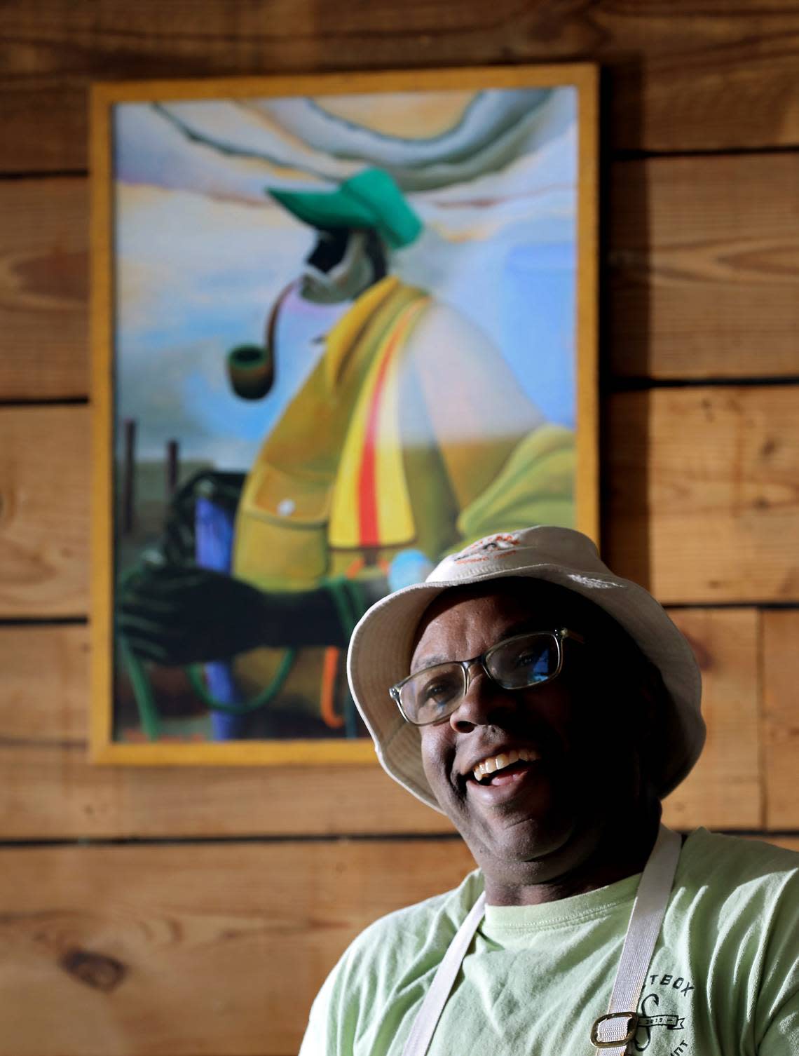 Ricky Moore, chef and owner of Saltbox Seafood Joint, smiles while he talks about the restaurant on Monday, Nov. 14, 2022, in Durham, N.C. Moore is The News & Observer’s 2022 Tar Heel of the Year.