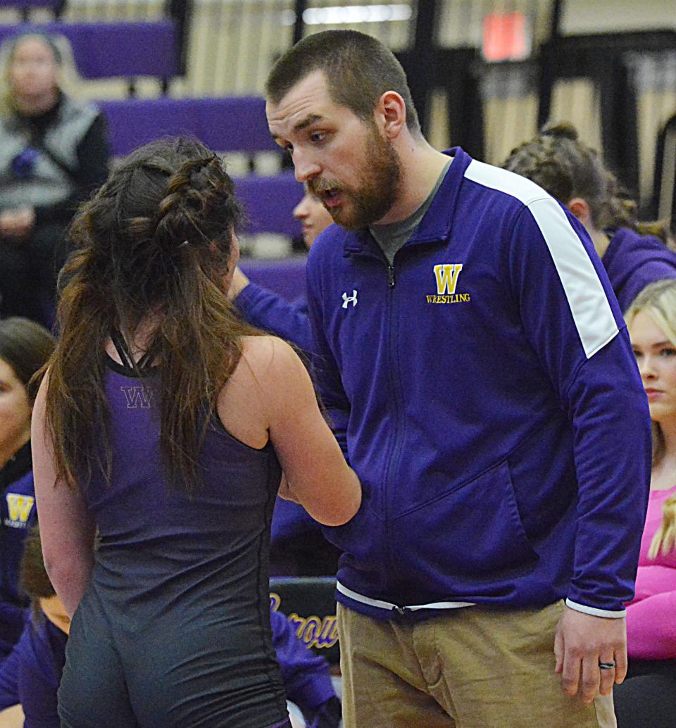 Watertown High School girls wrestling coach Dexter Gaikowski visits with wrestler Avah Grismer during an Eastern South Dakota Conference girls dual against Brookings on Thursday, Dec. 14, 2023 in the Civic Arena.