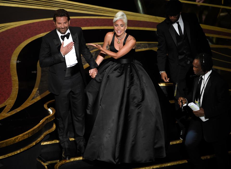 Bradley Cooper, left, and Lady Gaga bask in the audience applause after their performance of "Shallow" from the Oscars.