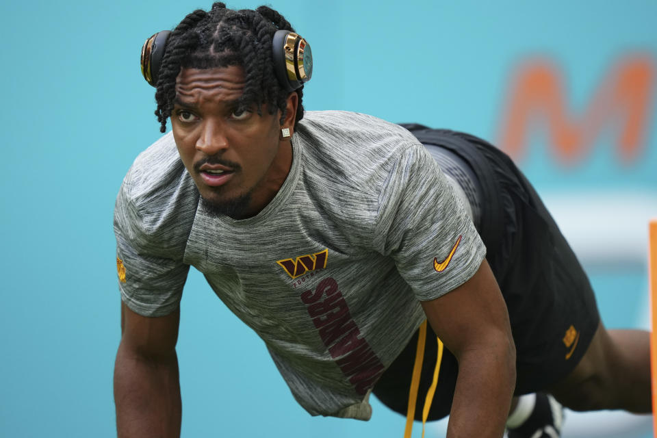 MIAMI GARDENS, FLORIDA - AUGUST 17: Jayden Daniels #5 of the Washington Commanders warms up prior to a preseason game against the Miami Dolphins at Hard Rock Stadium on August 17, 2024 in Miami Gardens, Florida.  (Photo by Rich Storry/Getty Images)