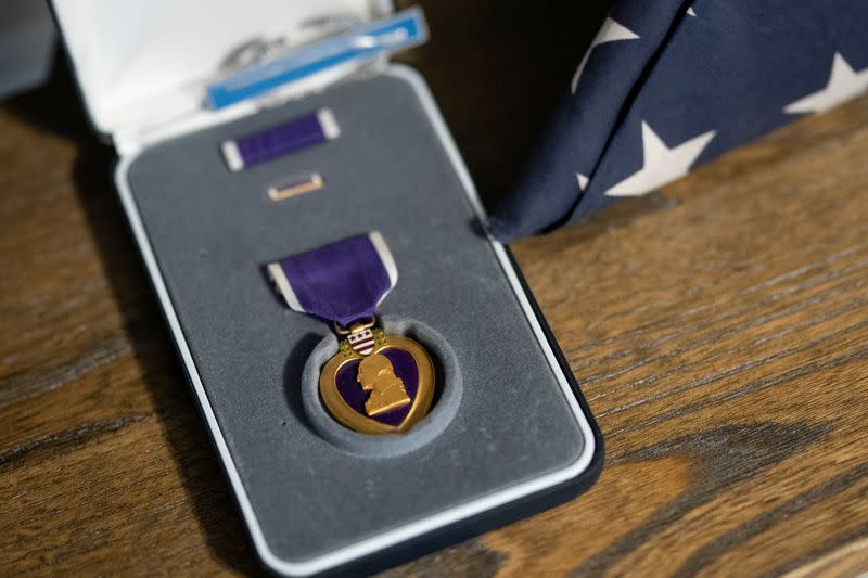 Retired Army Captain Dan Berschinski's Purple Heart is seen on a shelf at his home in Atlanta, Georgia