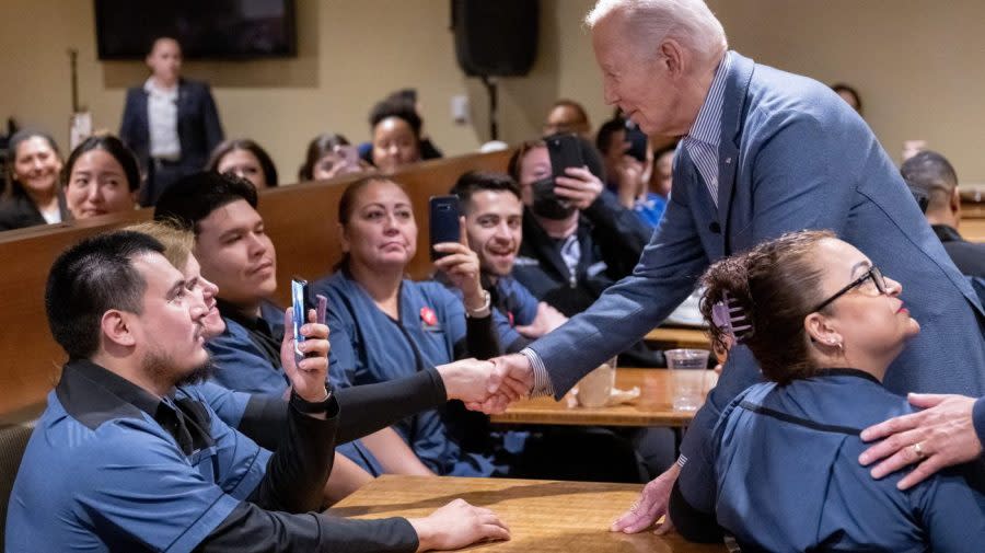 <em>Biden speaks with members of the Culinary Workers Union Local 226 following their successful contract negotiations at the Vdara Hotel in Las Vegas on Feb. 5, 2024.</em> (Photo by SAUL LOEB / AFP) (Photo by SAUL LOEB/AFP via Getty Images)