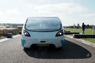 The solar-powered vehicle is on display on a closed road, in Guyancourt, south of Paris, Friday Sept. 24, 2021. A group of Dutch students has reimagined van life and is hitting the road to Portugal. Just don't call their groundbreaking new solar-powered vehicle a campervan. (AP Photo/Thibault Camus)