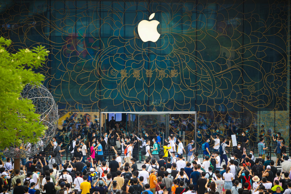 BEIJING, CHINA - JULY 17: People queue outside the Apple new flagship store at Sanlitun on July 17, 2020 in Beijing, China. (Photo by VCG/VCG via Getty Images)