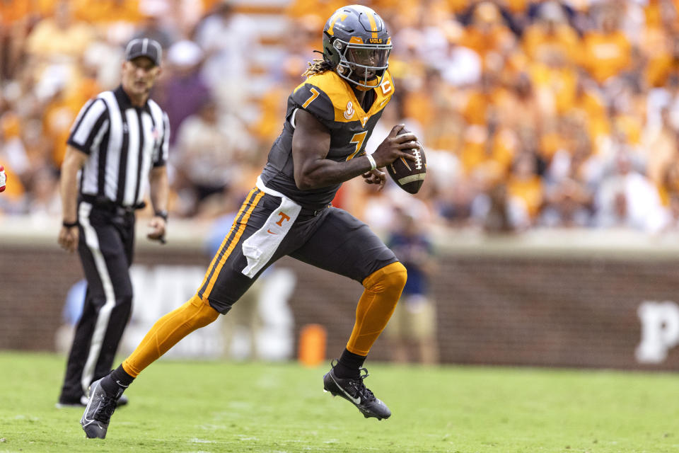 Tennessee quarterback Joe Milton III (7) runs for yardage during the first half of an NCAA college football game against Austin Peay, Saturday, Sept. 9, 2023, in Knoxville, Tenn. (AP Photo/Wade Payne)