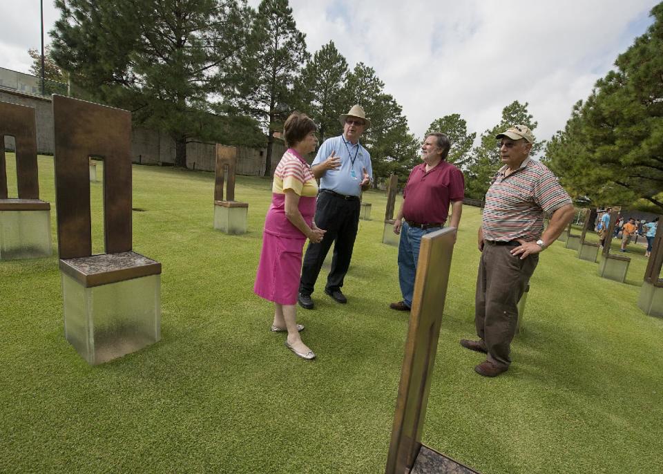 This undated image released by The Oklahoma City National Memorial & Museum shows visitors to the chairs memorial in Oklahoma City. The memorial is where visitors can pay tribute to the people who were killed and those who survived the bombing at the Alfred P. Murrah Federal Building on April 19, 1995. While the Memorial Museum has an admission fee, the outdoor memorial, full of symbolism, is free and open year round. (AP Photo/The Oklahoma City National Memorial & Museum)