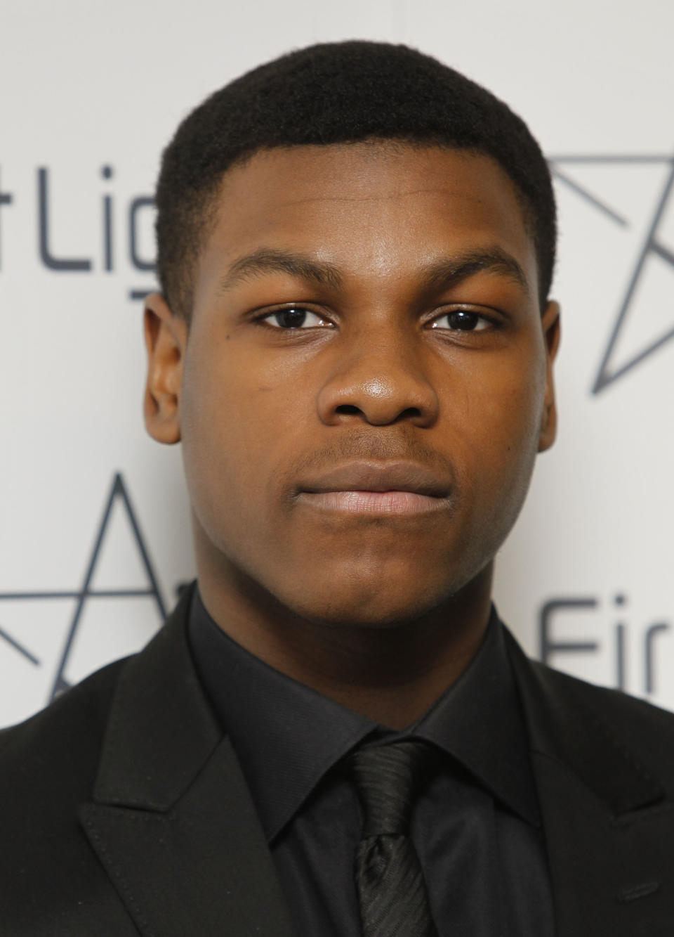 FILE - In this March 5, 2012 file photo, British actor John Boyega stands for photos after he presented the First Light Awards, in London. The cast of “Star Wars: Episode VII” was announced Tuesday, Aril 29, 2014, on the official “Star Wars” website by Lucasfilm. Actors Adam Driver, Oscar Isaac, Max von Sydow, Daisy Ridley, Domhnall Gleeson and Boyega will be joining the cast. (AP Photo/Joel Ryan, File)