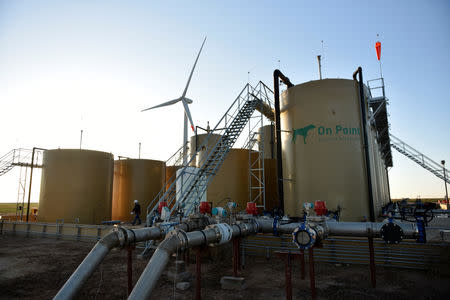 Storage tanks containing produced water are seen at a wastewater injection facility operated by On Point Energy in Big Spring, Texas U.S. February 12, 2019. Picture taken February 12, 2019. REUTERS/Nick Oxford