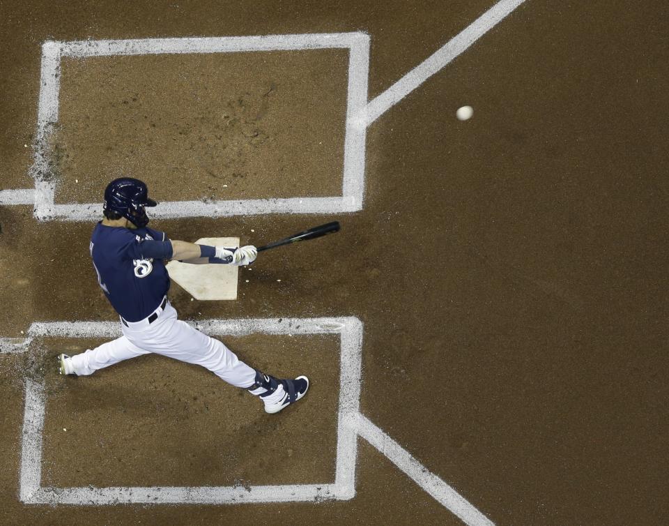 Milwaukee Brewers' Christian Yelich hits a home run during the first inning of a baseball game against the St. Louis Cardinals Saturday, March 30, 2019, in Milwaukee. (AP Photo/Morry Gash)