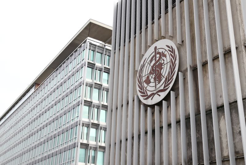 A logo is pictured on the headquarters of the WHO in Geneva