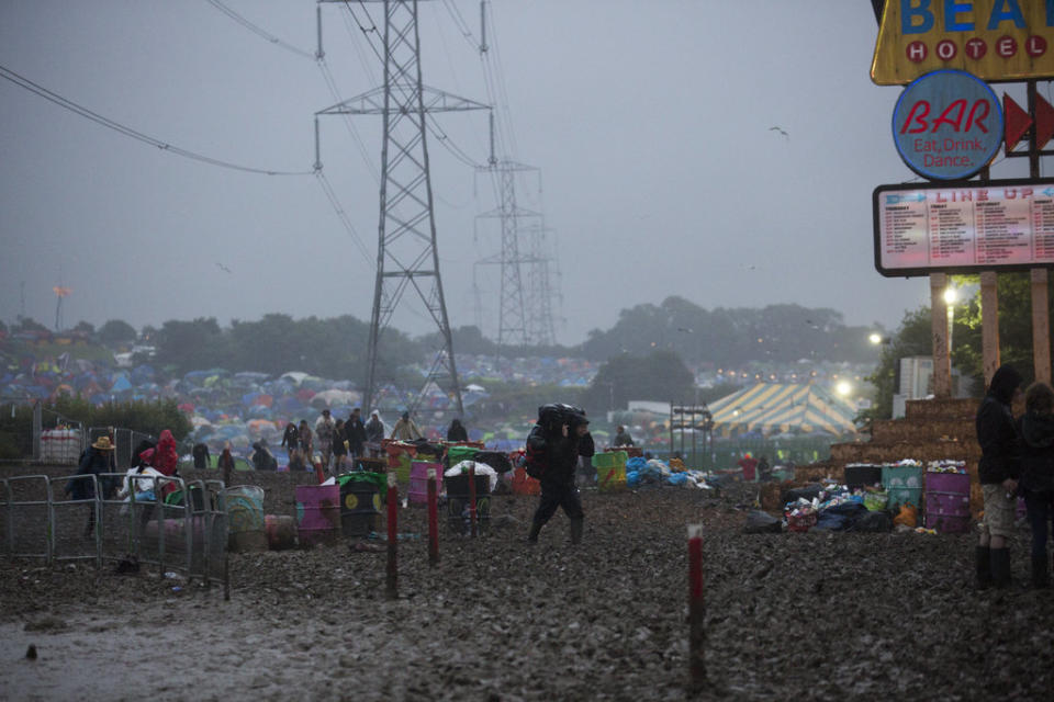 The rain falls on an already muddy Glastonbury.