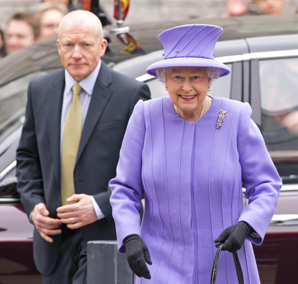 LONDON, UNITED KINGDOM - FEBRUARY 27: (EMBARGOED FOR PUBLICATION IN UK NEWSPAPERS UNTIL 48 HOURS AFTER CREATE DATE AND TIME) Queen Elizabeth II, flanked by her Police Protection Officer, arrives to open the new National Centre for Bowel Research and Surgical Innovation at Queen Mary, University of London on February 27, 2013 in London, England.  (Photo by Indigo/Getty Images)