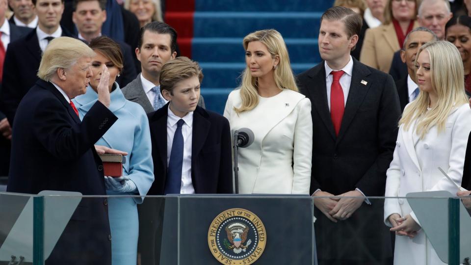 Mandatory Credit: Photo by Patrick Semansky/AP/Shutterstock (7936306bu)Donald Trump is sworn in as the 45th president of the United States by Chief Justice John Roberts as Melania Trump and his children look on during the 58th Presidential Inauguration at the U.