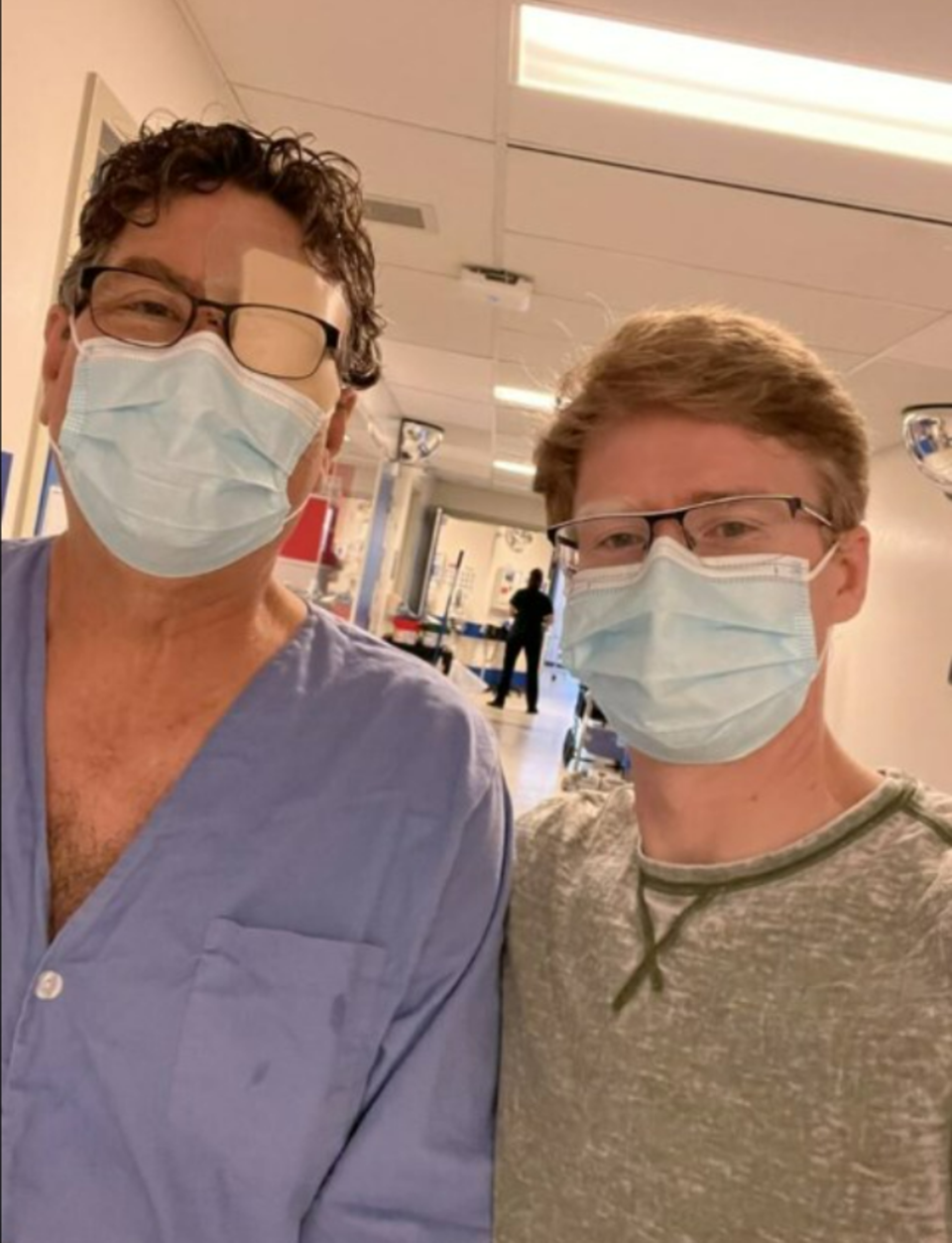 Ed Steinkamp, left, and his son, Bret Steinkamp, right, pose in the hospital together after the terrifying ordeal that saw the 67-year-old lose the use of his eye. (GoFundMe/Bret Steinkamp)