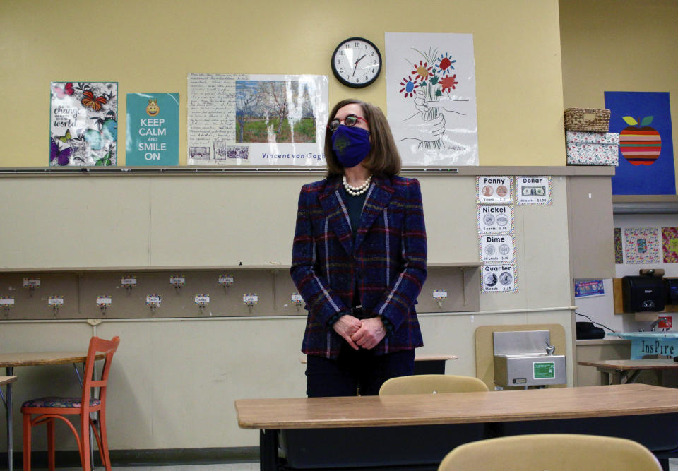 FILE - In this March 5, 2020, file photo, Oregon Gov. Kate Brown visits Sitton Elementary School in Portland, Ore. Gov. Brown has faced criticism from Republicans and business groups for being slow to lift coronavirus restrictions in the state. (Eder Campuzano/The Oregonian via AP, File)