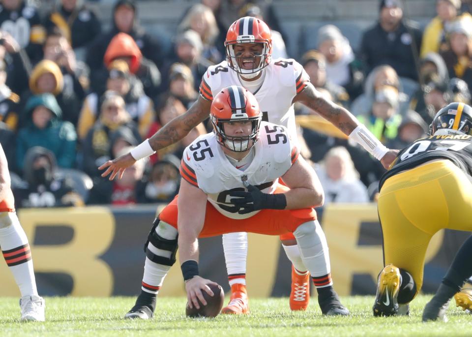 Jan 8, 2023; Pittsburgh, Pennsylvania, USA;  Cleveland Browns quarterback Deshaun Watson (4) changes the play at the line of scrimmage as he awaits the snap from center Ethan Pocic (55) against the Pittsburgh Steelers during the second quarter at Acrisure Stadium. Mandatory Credit: Charles LeClaire-USA TODAY Sports