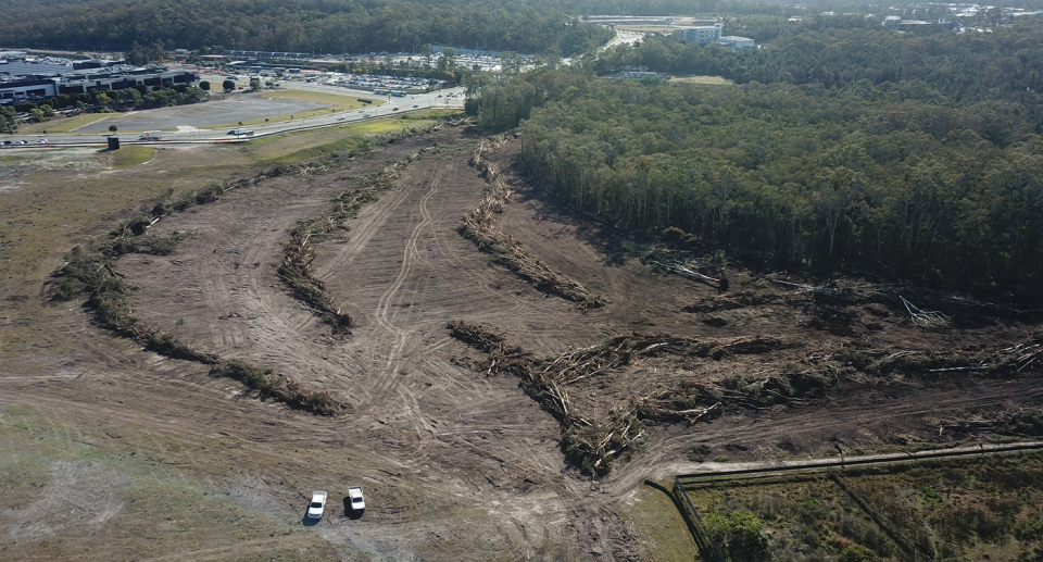 An aerial view of logged forest in Coomera.