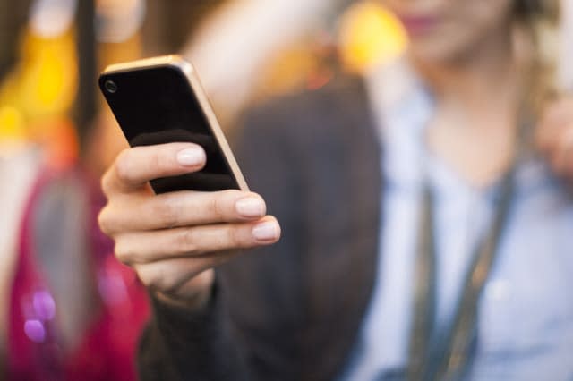 Woman taking selfie with smartphone