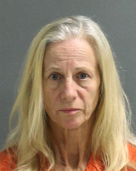 Joanne Mercader, shown in a booking photo taken Saturday by Volusia County Corrections, is accused of battery after authorities say she threw a bucket of human feces at her landlord in Osteen, Florida. (Photo: Volusia County Corrections via ASSOCIATED PRESS)