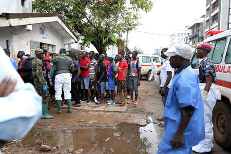 Relatives of the victims line up at the entrance of Connaught Hospital in Freetown, Sierra Leone August 16, 2017. REUTERS/Afolabi Sotunde