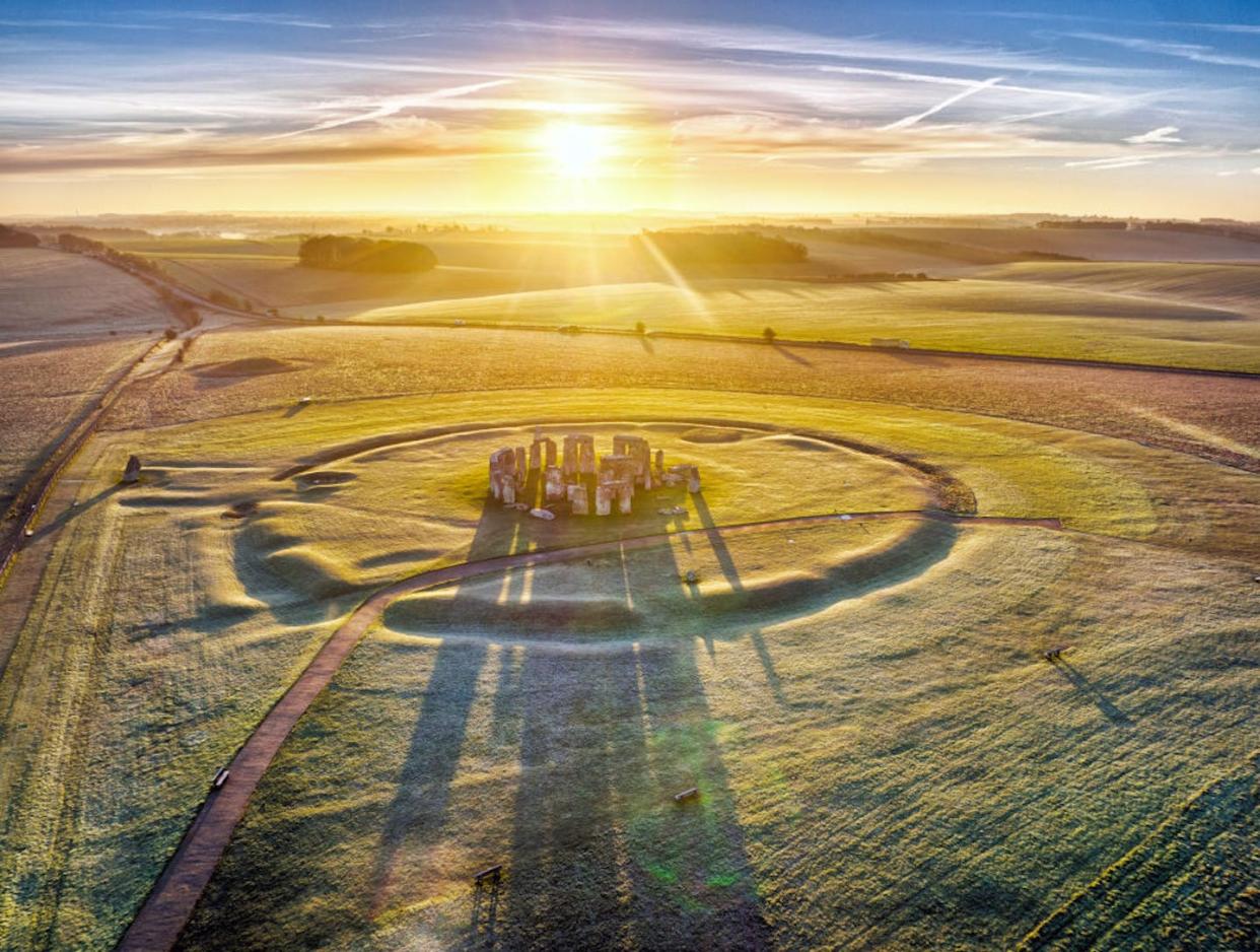 Stonehenge has long been the site of some of the most famous solstice celebrations. <a href="https://www.gettyimages.com/detail/news-photo/drone-point-of-view-of-the-sun-rising-over-stonehenge-on-news-photo/1366013168?phrase=winter%20solstice%20stonehenge&adppopup=true" rel="nofollow noopener" target="_blank" data-ylk="slk:Chris Gorman/Getty Images News;elm:context_link;itc:0;sec:content-canvas" class="link ">Chris Gorman/Getty Images News</a>